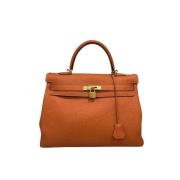 Pre-owned Leather handbags Hermès Vintage , Orange , Dames