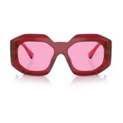 Zonnebril met onregelmatige vorm, fuchsia lens en transparant rood mon...