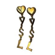 Pre-owned Metal earrings Yves Saint Laurent Vintage , Yellow , Dames