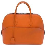 Pre-owned Leather handbags Hermès Vintage , Orange , Dames