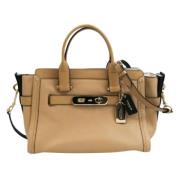 Pre-owned Leather handbags Coach Pre-owned , Beige , Dames