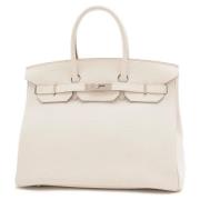 Pre-owned Leather handbags Hermès Vintage , Beige , Dames