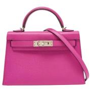 Pre-owned Leather handbags Hermès Vintage , Pink , Dames