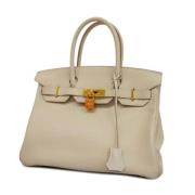 Pre-owned Fabric handbags Hermès Vintage , Beige , Dames