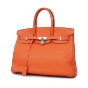 Pre-owned Leather handbags Hermès Vintage , Orange , Dames