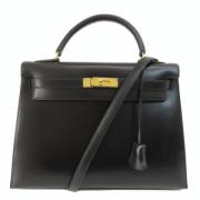 Pre-owned Leather handbags Hermès Vintage , Black , Dames