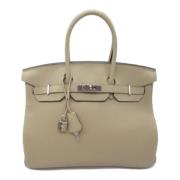 Pre-owned Leather handbags Hermès Vintage , Beige , Dames