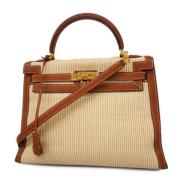 Pre-owned Canvas handbags Hermès Vintage , Beige , Dames