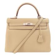 Pre-owned Leather handbags Hermès Vintage , Beige , Dames