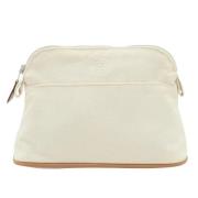 Pre-owned Canvas clutches Hermès Vintage , Beige , Dames