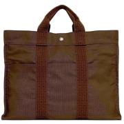 Pre-owned Canvas handbags Hermès Vintage , Brown , Unisex