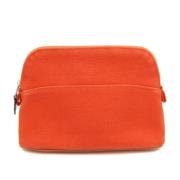 Pre-owned Leather pouches Hermès Vintage , Orange , Dames