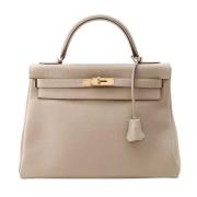 Pre-owned Leather handbags Hermès Vintage , Beige , Dames