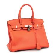 Pre-owned Leather handbags Hermès Vintage , Orange , Dames