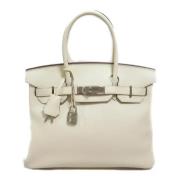 Pre-owned Leather handbags Hermès Vintage , Beige , Dames