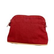 Pre-owned Canvas clutches Hermès Vintage , Red , Dames