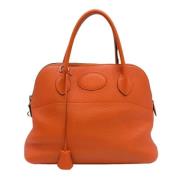 Pre-owned Leather handbags Hermès Vintage , Orange , Dames