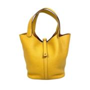 Pre-owned Leather handbags Hermès Vintage , Yellow , Dames