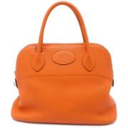 Pre-owned Leather handbags Hermès Vintage , Orange , Dames