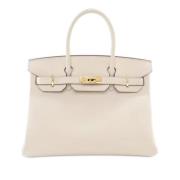 Pre-owned Leather handbags Hermès Vintage , Beige , Dames