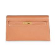 Pre-owned Leather clutches Hermès Vintage , Brown , Dames