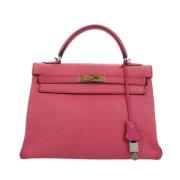 Pre-owned Leather handbags Hermès Vintage , Pink , Dames