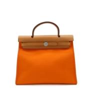 Pre-owned Canvas handbags Hermès Vintage , Orange , Dames