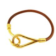 Pre-owned Metal bracelets Hermès Vintage , Yellow , Dames