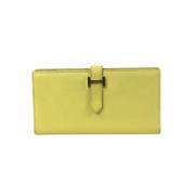 Pre-owned Leather wallets Hermès Vintage , Yellow , Dames