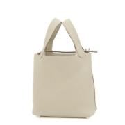 Pre-owned Leather handbags Hermès Vintage , Beige , Dames