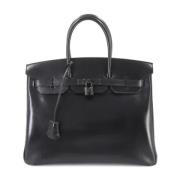 Pre-owned Leather handbags Hermès Vintage , Black , Dames