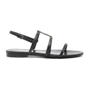 Zwarte platte sandalen met gouden logo Saint Laurent , Black , Dames