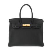 Pre-owned Leather handbags Hermès Vintage , Black , Dames