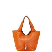 Pre-owned Leather handbags Hermès Vintage , Orange , Dames