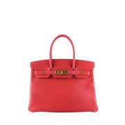 Pre-owned Leather handbags Hermès Vintage , Red , Dames