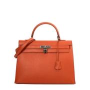 Pre-owned Leather handbags Hermès Vintage , Orange , Dames