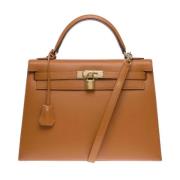 Pre-owned Leather handbags Hermès Vintage , Orange , Dames