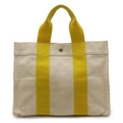 Pre-owned Canvas handbags Hermès Vintage , Yellow , Dames