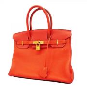 Pre-owned Leather handbags Hermès Vintage , Orange , Dames