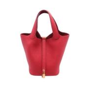 Pre-owned Leather handbags Hermès Vintage , Red , Dames