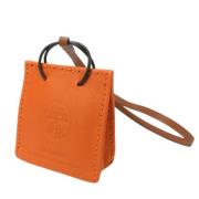 Pre-owned Leather key-holders Hermès Vintage , Orange , Dames