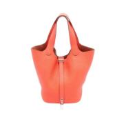 Pre-owned Leather handbags Hermès Vintage , Orange , Dames