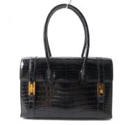 Pre-owned Leather handbags Hermès Vintage , Black , Dames