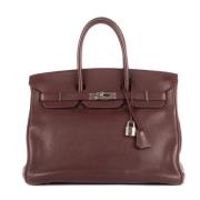 Pre-owned Leather handbags Hermès Vintage , Red , Dames