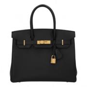 Pre-owned Leather handbags Hermès Vintage , Black , Dames