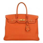 Pre-owned Leather handbags Hermès Vintage , Orange , Dames