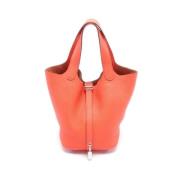 Pre-owned Leather handbags Hermès Vintage , Orange , Dames