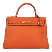 Pre-owned Leather handbags Hermès Vintage , Orange , Dames