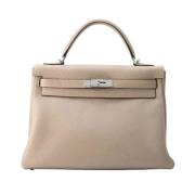 Pre-owned Leather handbags Hermès Vintage , Beige , Dames