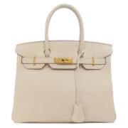 Pre-owned Leather handbags Hermès Vintage , Beige , Dames